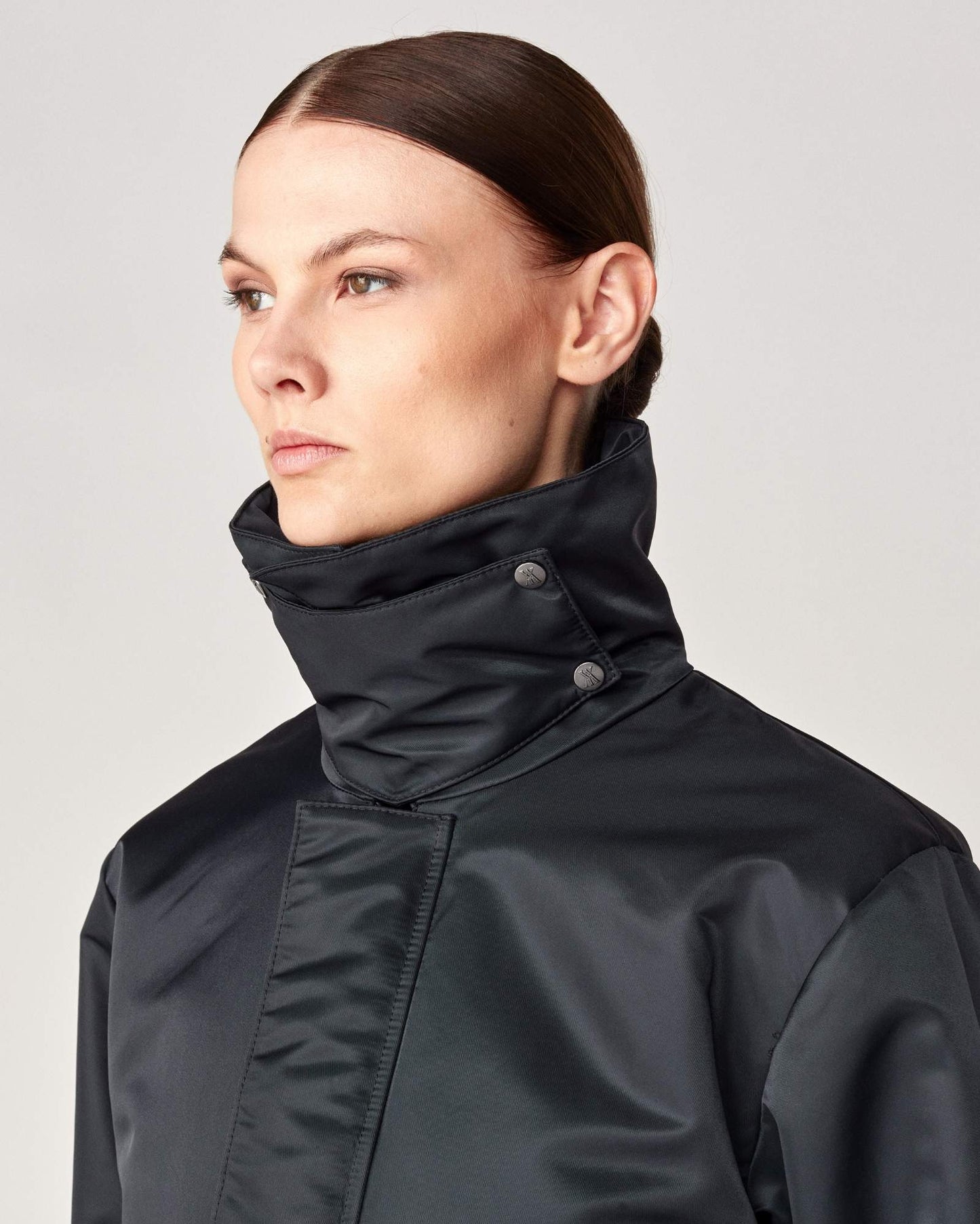 Short oversized jacket with 2-way collar in black/green Yagya