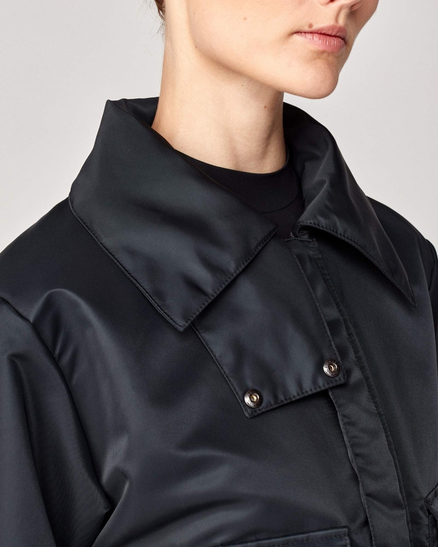 Short oversized jacket with 2-way collar in black/green Yagya