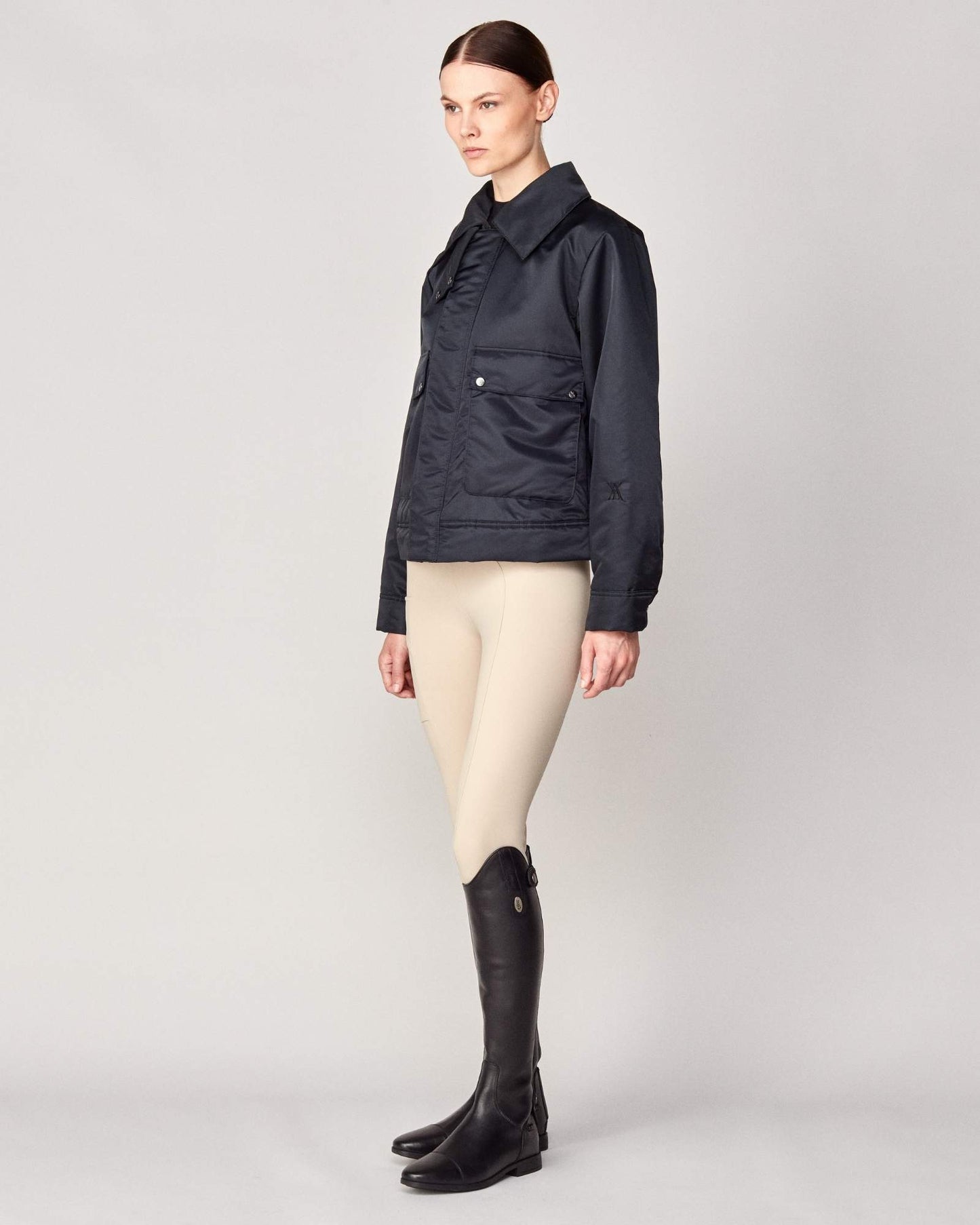 Short oversized jacket with 2-way collar in black/green Yagya