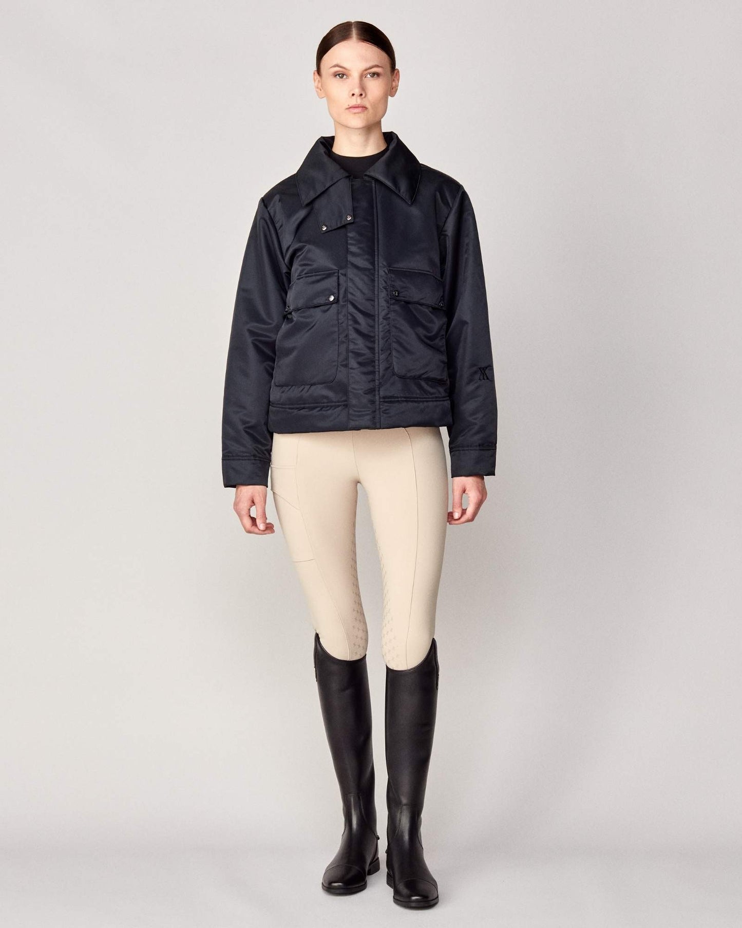 Short oversized jacket with 2-way collar in black/green Yagya