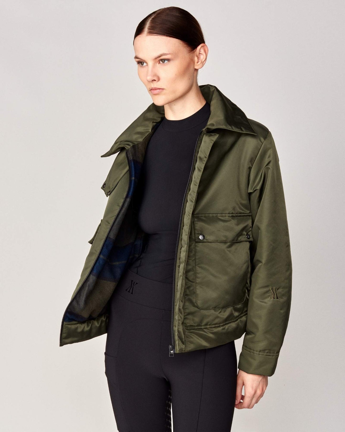 Short oversized jacket with 2-way collar in black/green Yagya