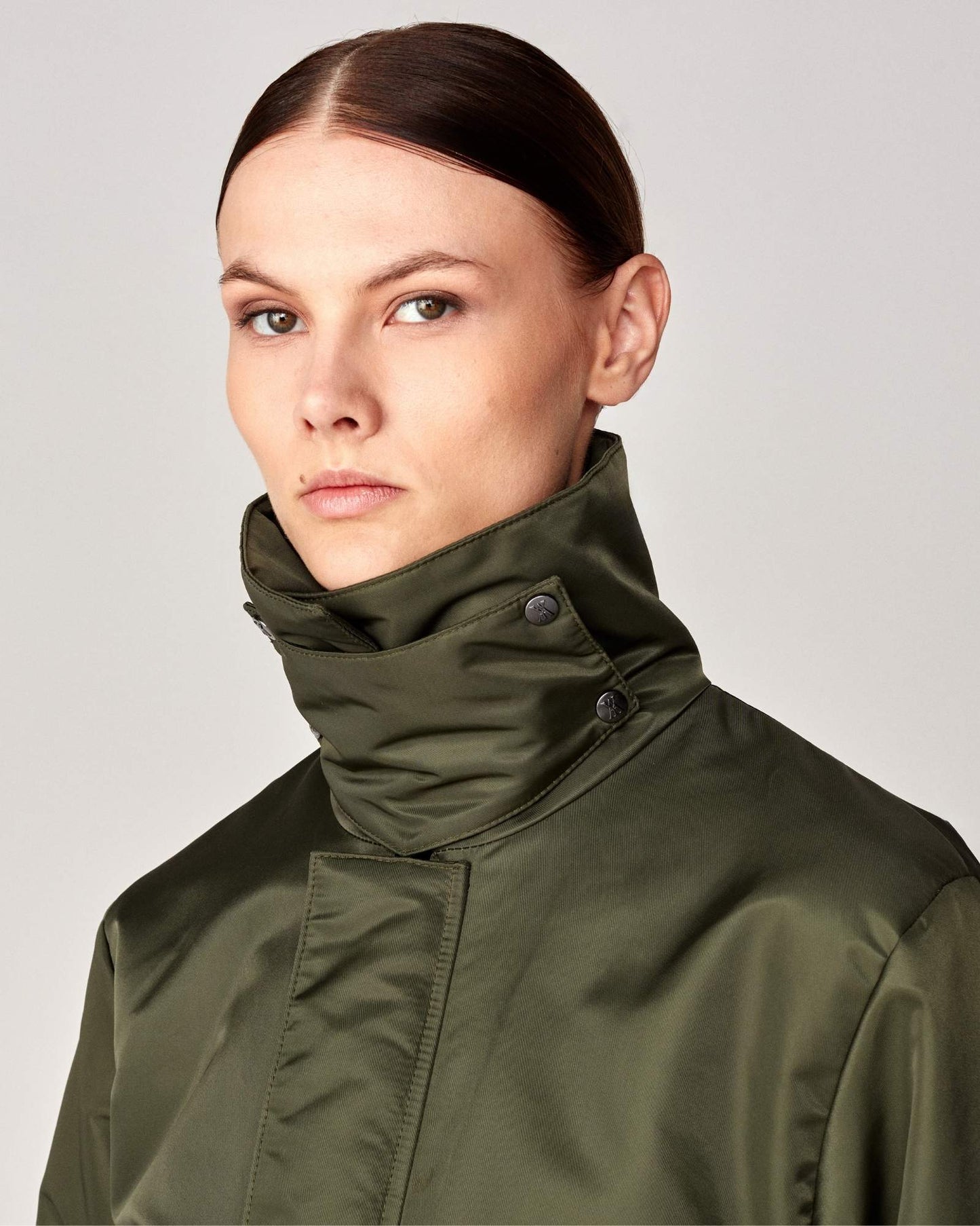 Short oversized jacket with 2-way collar in black/green Yagya