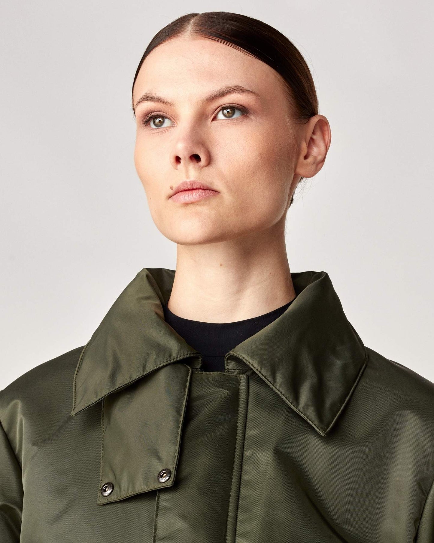 Short oversized jacket with 2-way collar in black/green Yagya