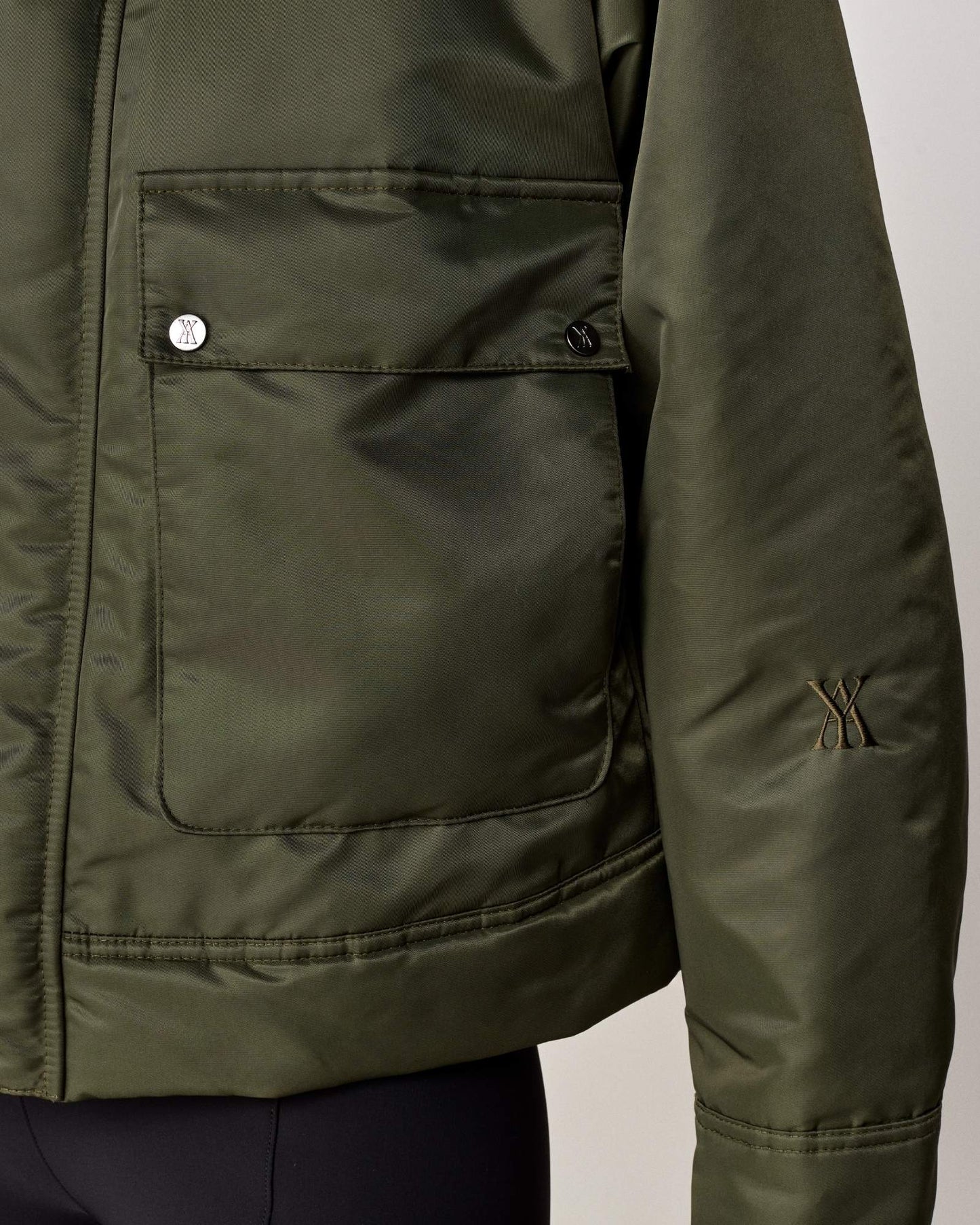 Short oversized jacket with 2-way collar in black/green Yagya
