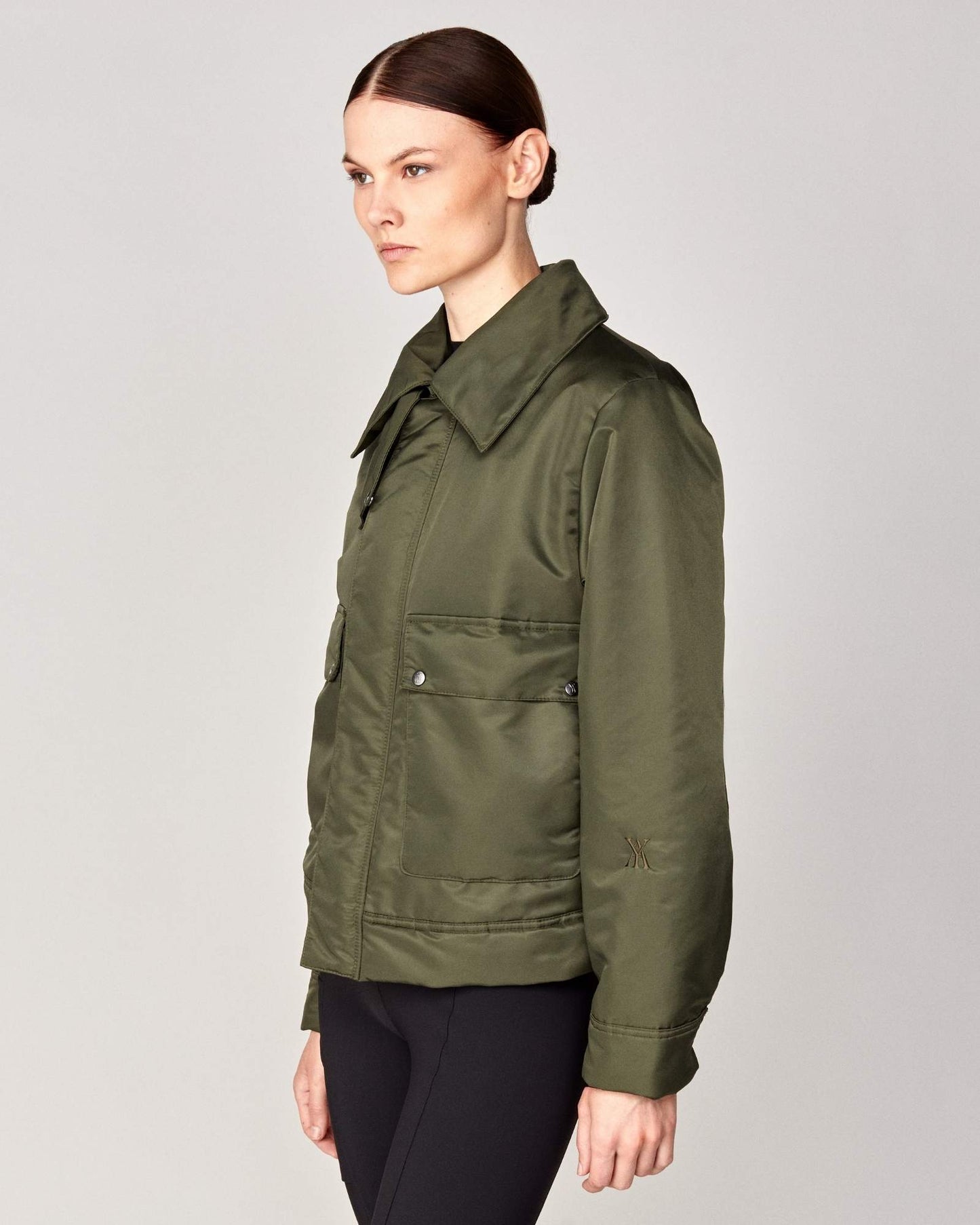 Short oversized jacket with 2-way collar in black/green Yagya